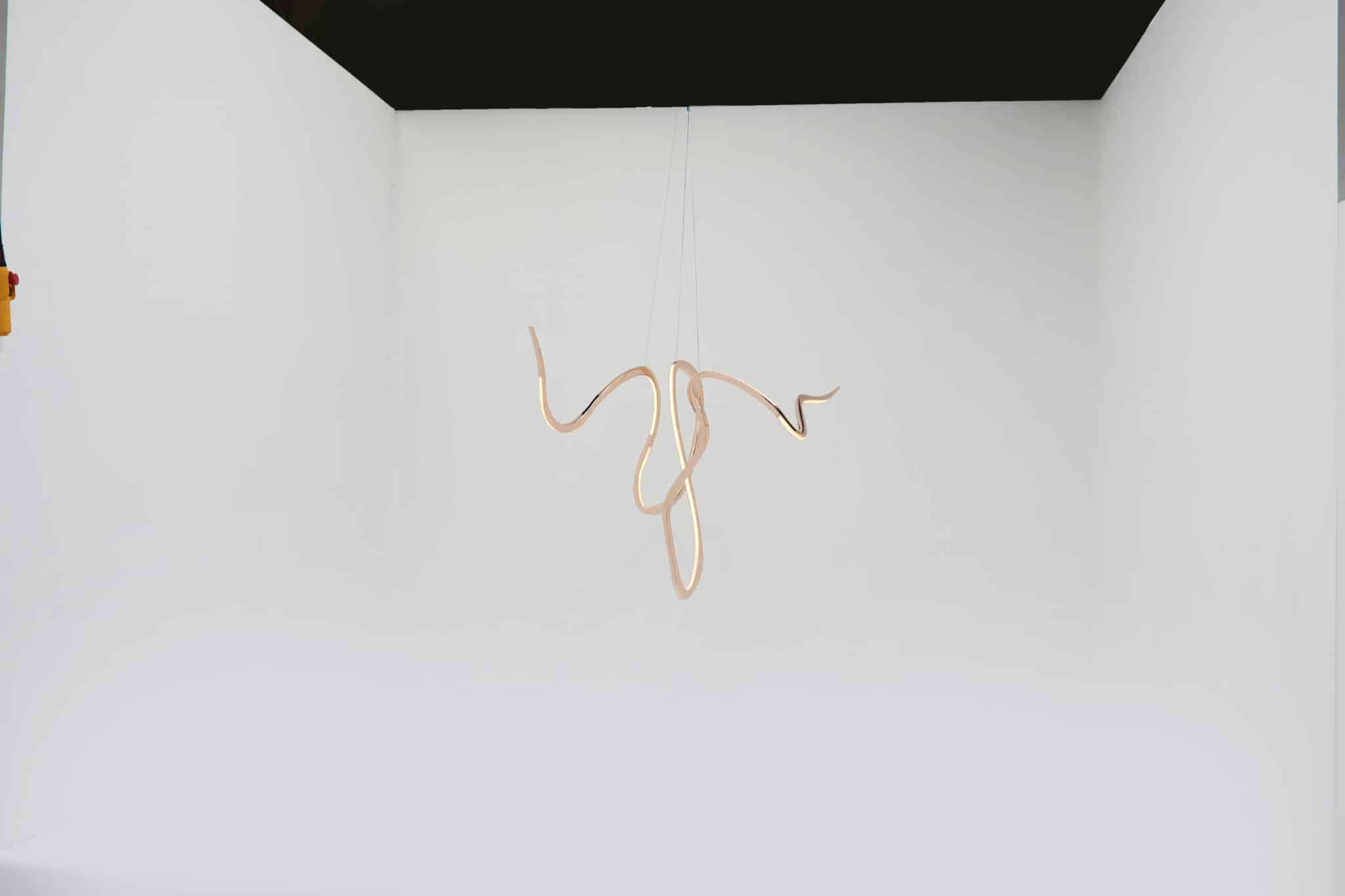 Niamh Barry Artist's hand V bronze suspended light sculpture 1